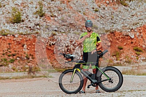 A professional triathlete preparing for a training ride on a bicycle