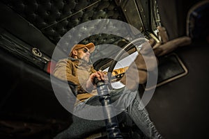 Professional Trucker in the Cabin of His Truck