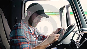 Professional trucker using truck gps navigation to transport and deliver goods to the destination. Transportation