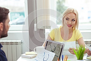 Professional two office workers are doing paperwork