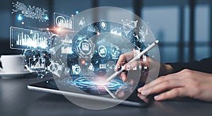 Professional using a digital tablet with futuristic data visualization graphics.