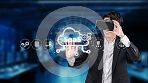 Professional using virtual reality in a modern office, showcasing cloud computing and software as a service technology