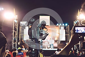 Professional video camera with abstract blurred background