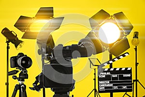 Professional video camera and lighting equipment in studio