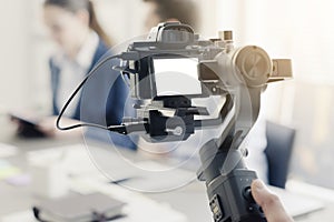 Professional videomaker shooting a video