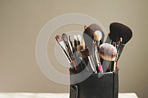 Professional visage brushes for face makeup on table. beauty salon