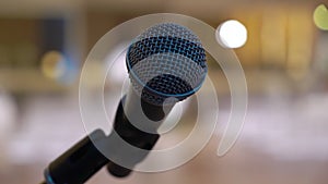 Professional vocal wire mic on microphone stand. Stage at concert