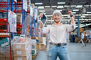 Professional warehouse manager or worker express action of happy and smiling in workplace area with concept of successful in his