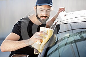 Professional washer wiping car window