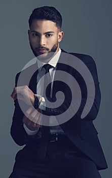 Professional, watch and man in suit with fashion for business in studio, dark background or portrait. Corporate, style