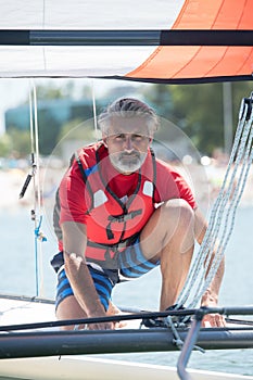 professional waterman training on lake with catamaran