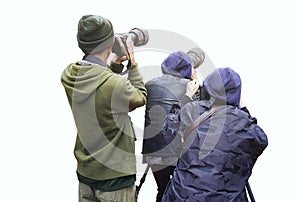 Professional wildlife photographer on white background ,Photographer takes a picture with professional camera, Nature photographer