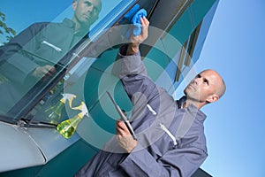 professional window cleaner cleaning outdoor panes