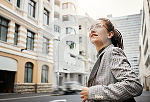 Professional woman in city, travel and commute to work with buildings, motion blur and waiting for taxi cab. Corporate