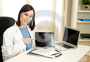 Professional woman Doctor having consultation showing test results on laptop to inform patient