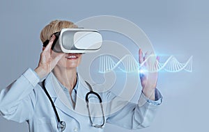 Professional woman doctor in VR glasses studying blue glowing virtual human DNA strand, using futuristic CRISPR method