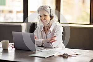 Professional Woman Engaged In Video Call Wearing Headset In Office