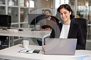 Professional woman manager operating laptop foe work in office