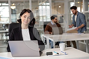 Professional woman manager operating laptop foe work in office