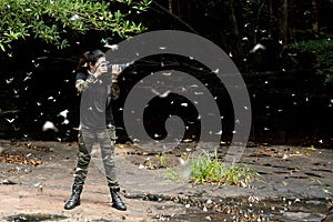 Professional woman photographer taking butterfly in the green jungle rain forest nature.