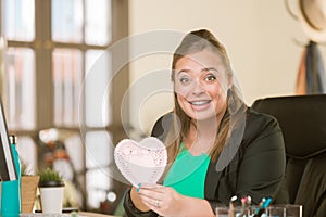 Professional Woman Reacting Positively to Valentine photo