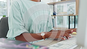 Professional woman working on computer, typing email or report on keyboard on table. Young latino lady in corporate