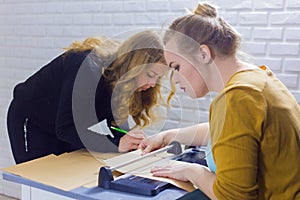 Professional women decorator working with kraft paper