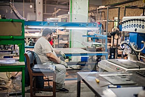 Professional worker technician machinist work in factory production workplace