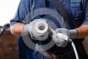 Professional workers will prepare pipes when installing heating system in empty apartment.