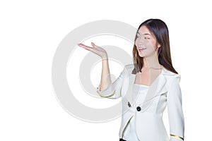 Professional young Asian female long brown hair in white suit is acting hand shows as presenting something and smiling working