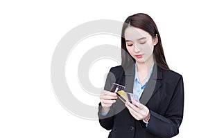 Professional young Asian woman office worker is choosing credit cards to use pay goods it is financial choice easy pay while
