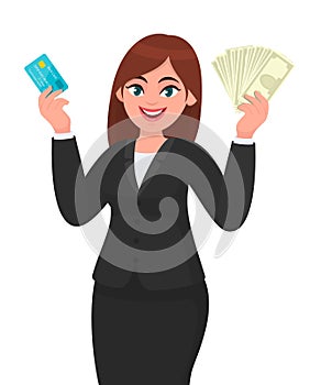 Professional young business woman showing/holding credit/debit/ATM banking card and cash/money/currency bank notes in hand. Modern