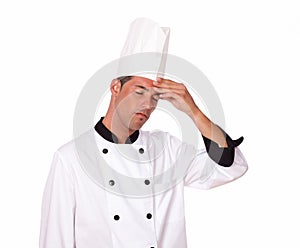 Professional young male chef with headache
