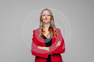 Professional young woman entrepreneur, real estate agent in suit cross arms and looking confident at camera. Successful