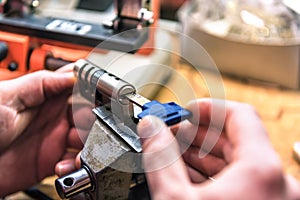 Locksmith master repairs door lock cylinder photo