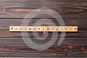 Professionalism word written on wood block. Professionalism text on cement table for your desing, concept
