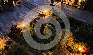 Professionally Landscaped and Illuminated Garden in the Evening photo