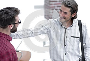 Professionals speak, standing in the office