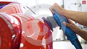 Professionals wear Chemical protective clothing at work.Car Care Business. Automobile industry. Car wash and coating business with