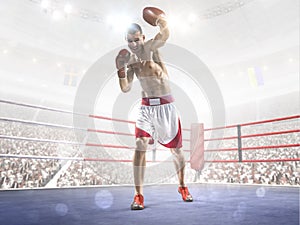 Professionl boxer is standing on the ring