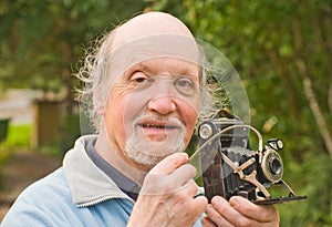 Professor with retro camera .