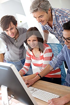 Professor with students working together