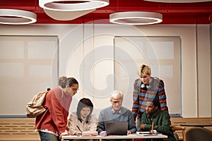 Professor with Students Working Together