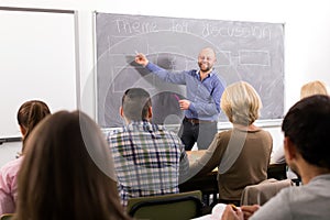 Professor teaching people at courses