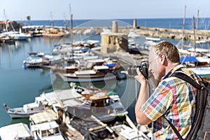 Proffesional photographer taking photo in marina