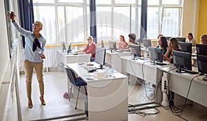 Back view of teacher in the classrom photo