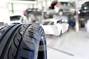 profil of car tyre in the car repair workshop - closeup photo