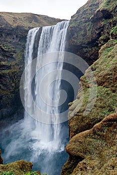 Profil view SkÃ³gafoss waterfall under MÃ½rdalsjÃ¶kull glacier