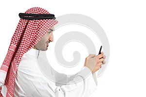 Profile of an arab saudi emirates man using a smart phone