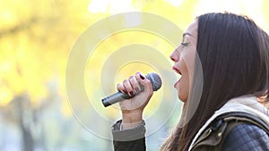 Profile of beautiful woman singing